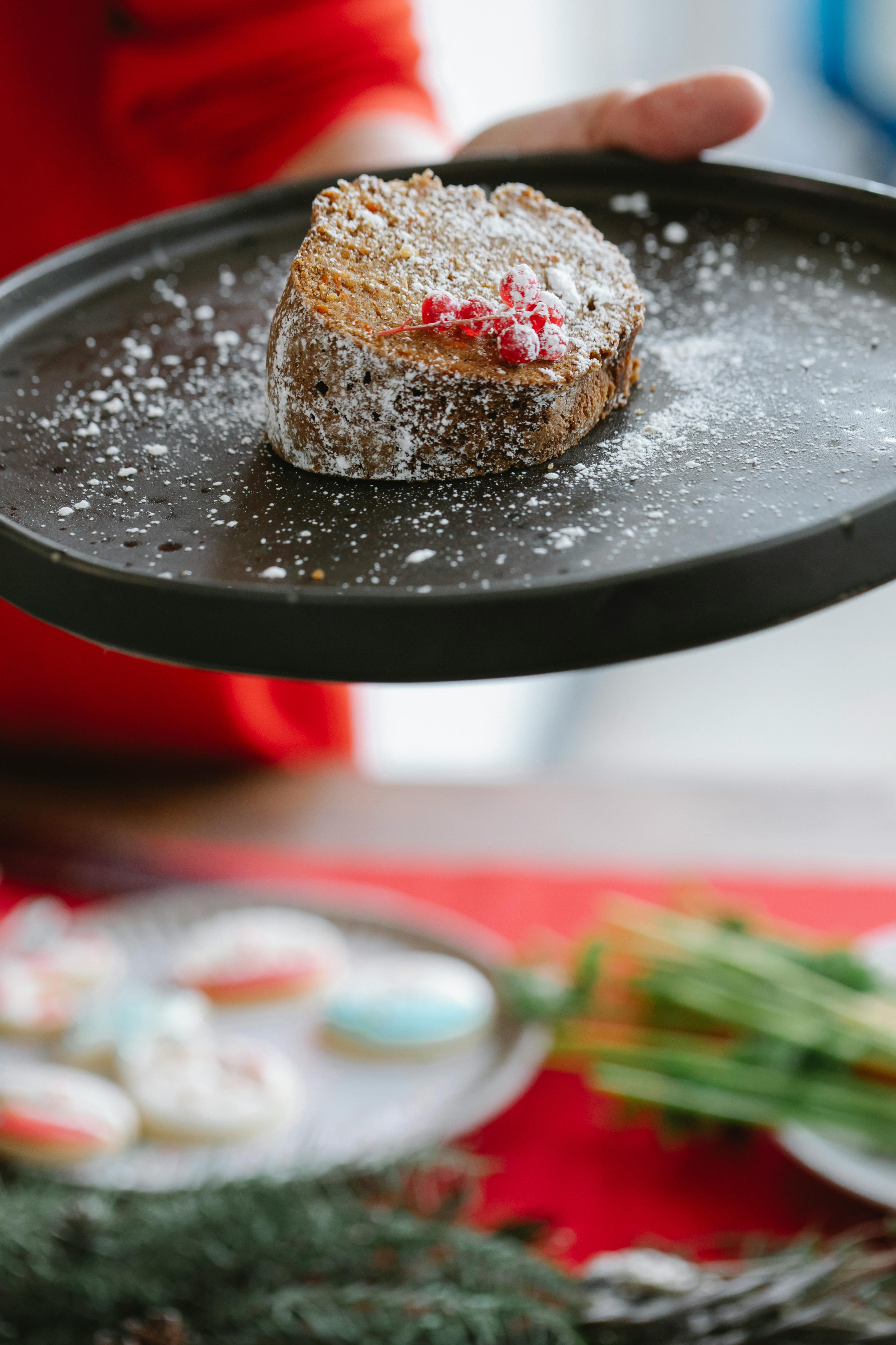 crop chef with delicious cake on plate