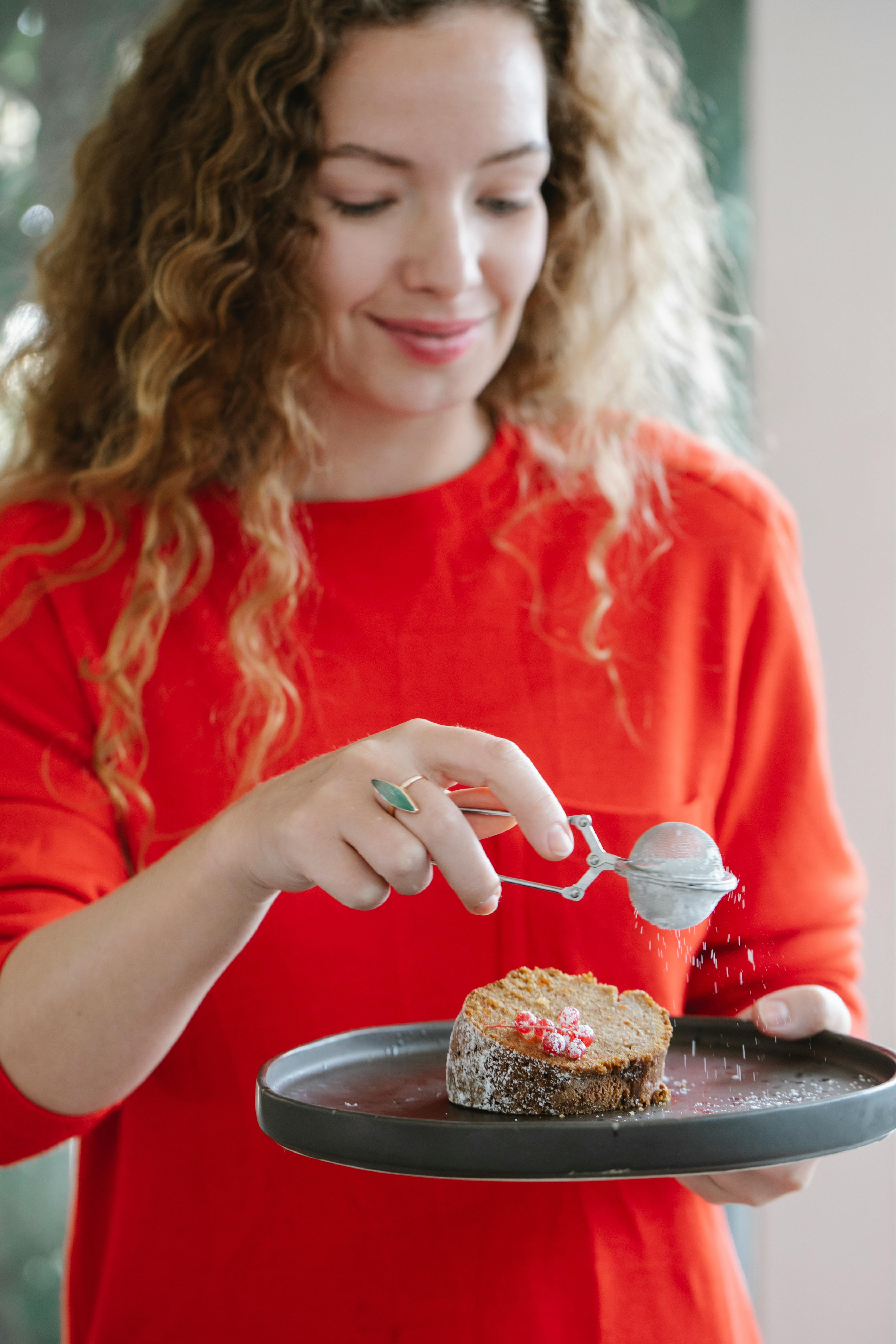 crop chef with delicious piece of cake at home