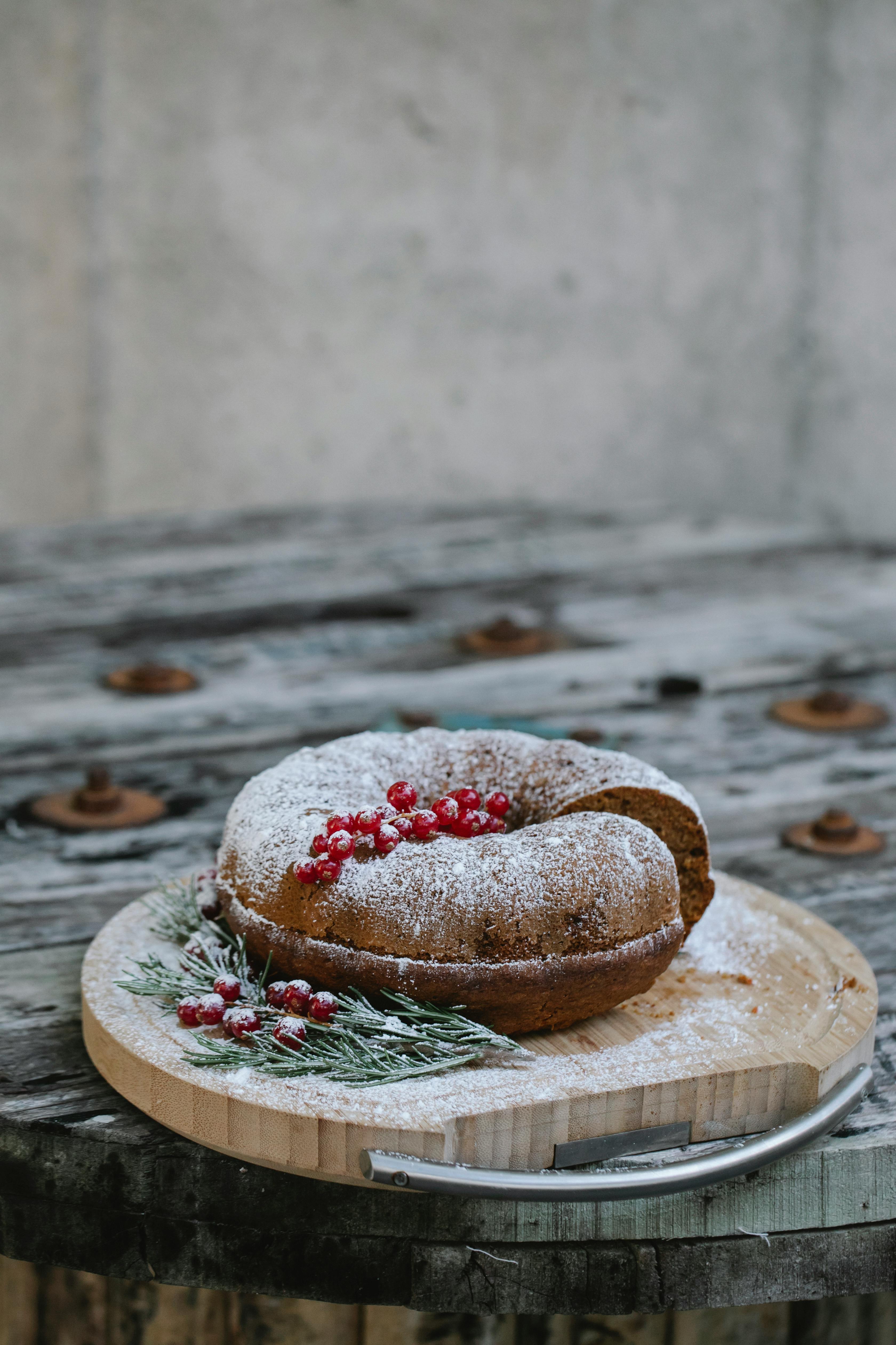 delicious cake with red currants on tray during christmas holiday