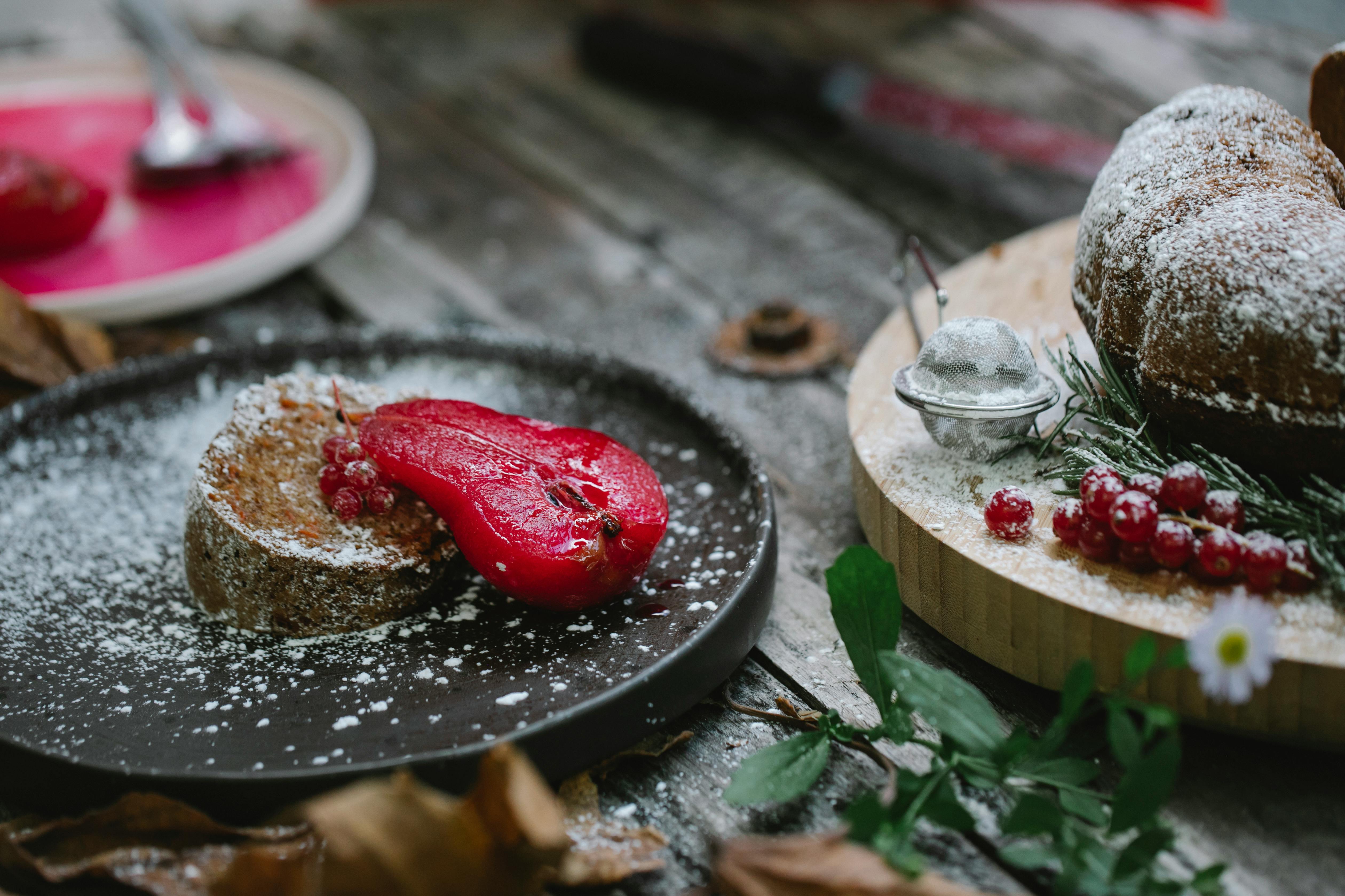 delicious pie garnished with baked pear served on black plate