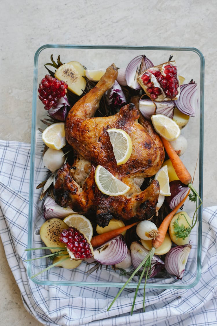 Grilled Whole Chicken With Vegetables And Fruits In Glass Bowl