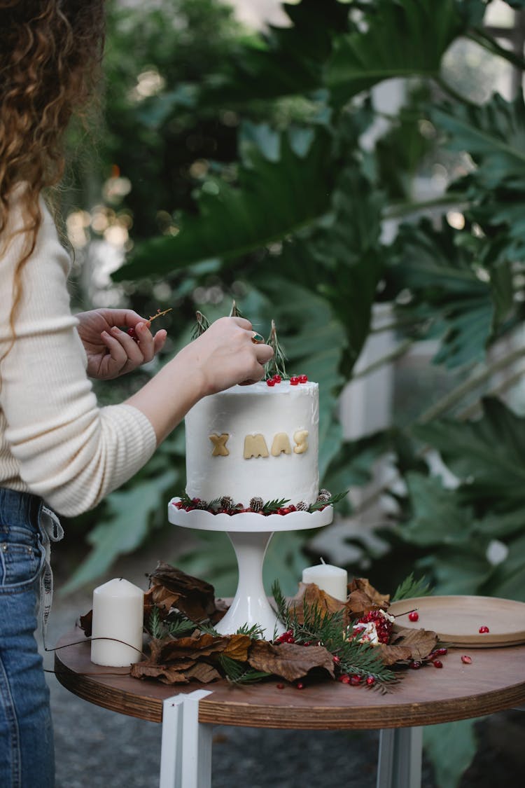 Crop Chef Decorating Delicious Christmas Cake In Garden