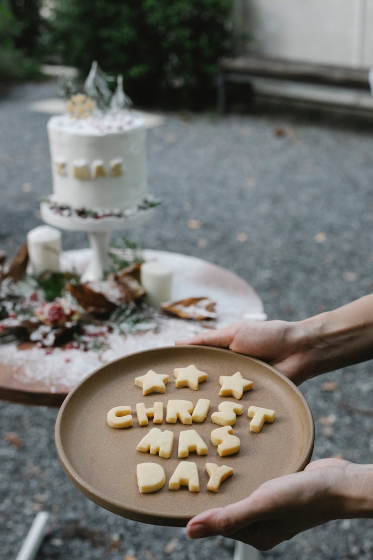 Crop Chef Showing Christmas Day Inscription On Plate Outdoors