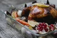 Appetizing roasted chicken with vegetables in baking dish