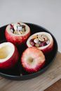 Tasty apples with assorted filling in baking pan