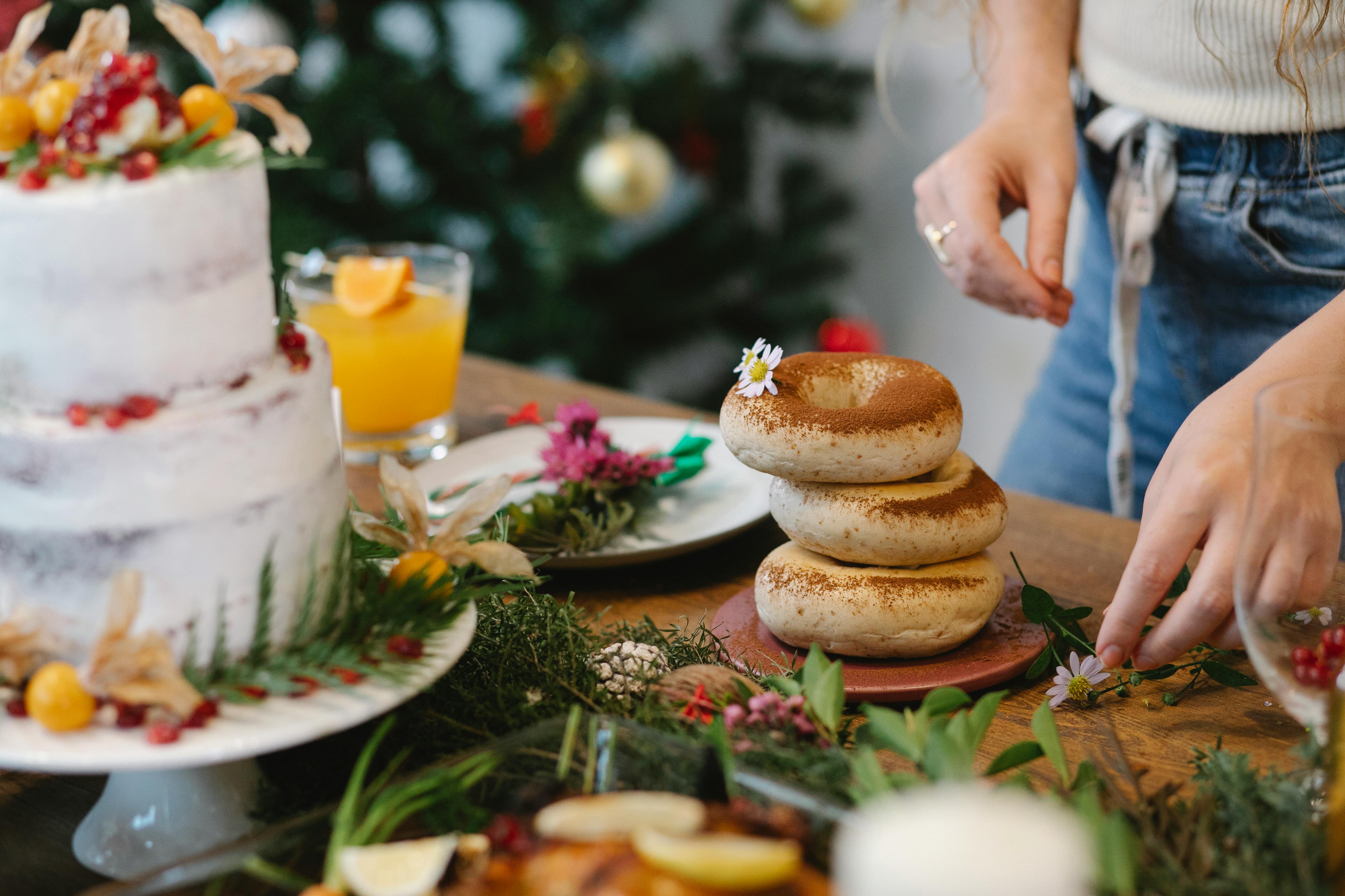 faceless chef decorating tasty bagels for christmas holiday at home