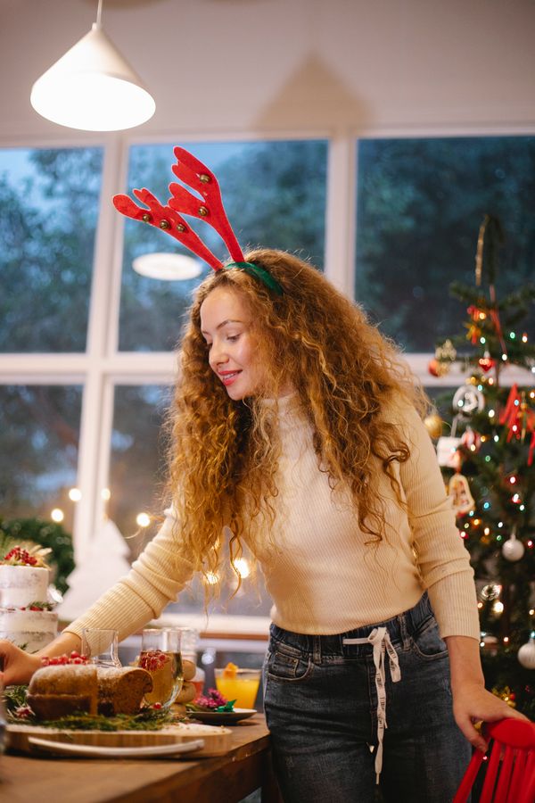 Woman in jeans with holiday blouse