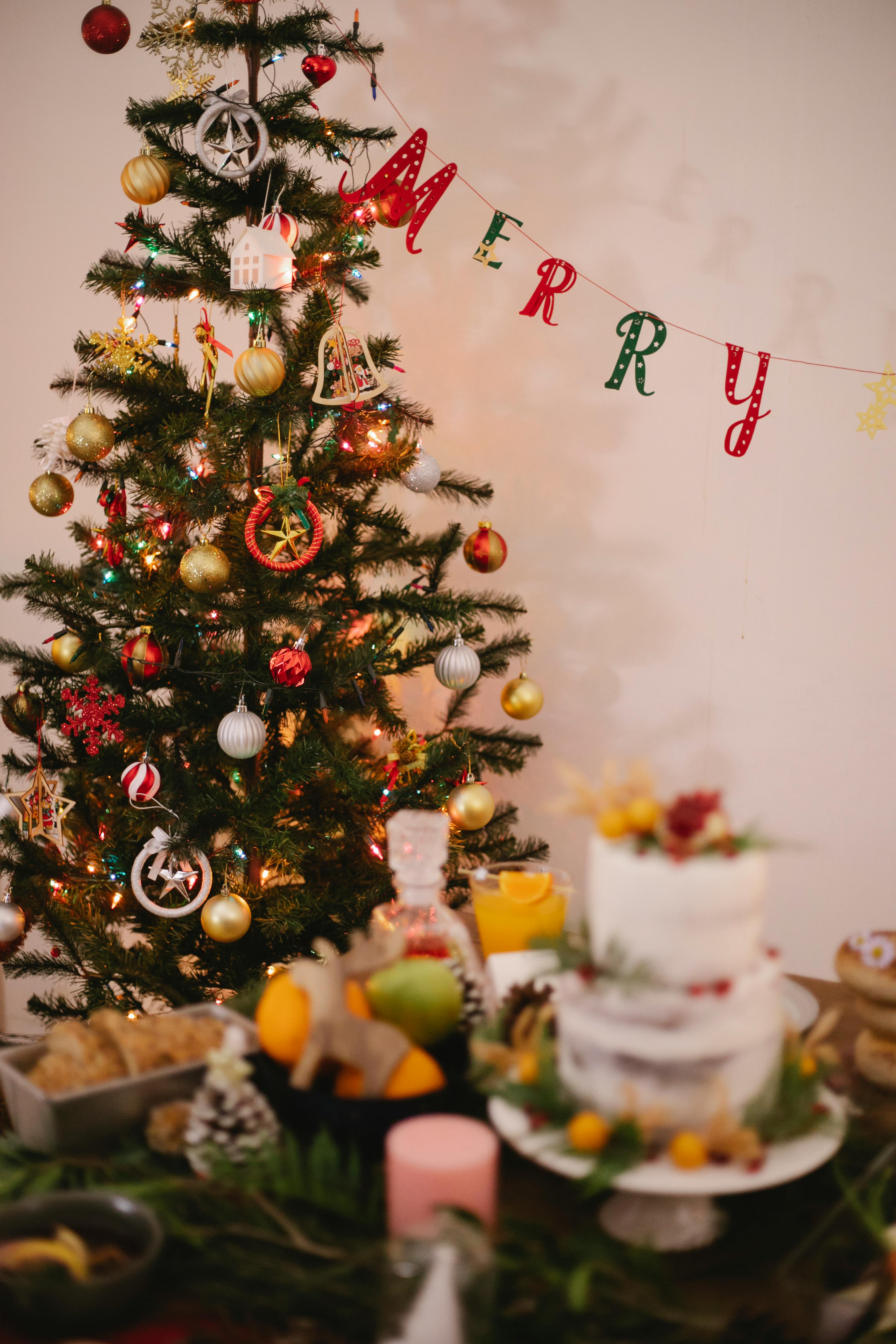Decorated Christmas tree with baubles at home · Free Stock Photo