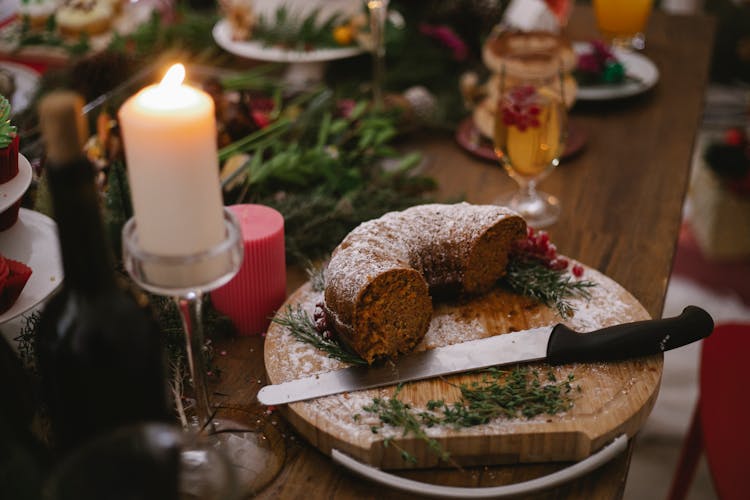 Burning Candle Near Tasty Chocolate Cake On Table