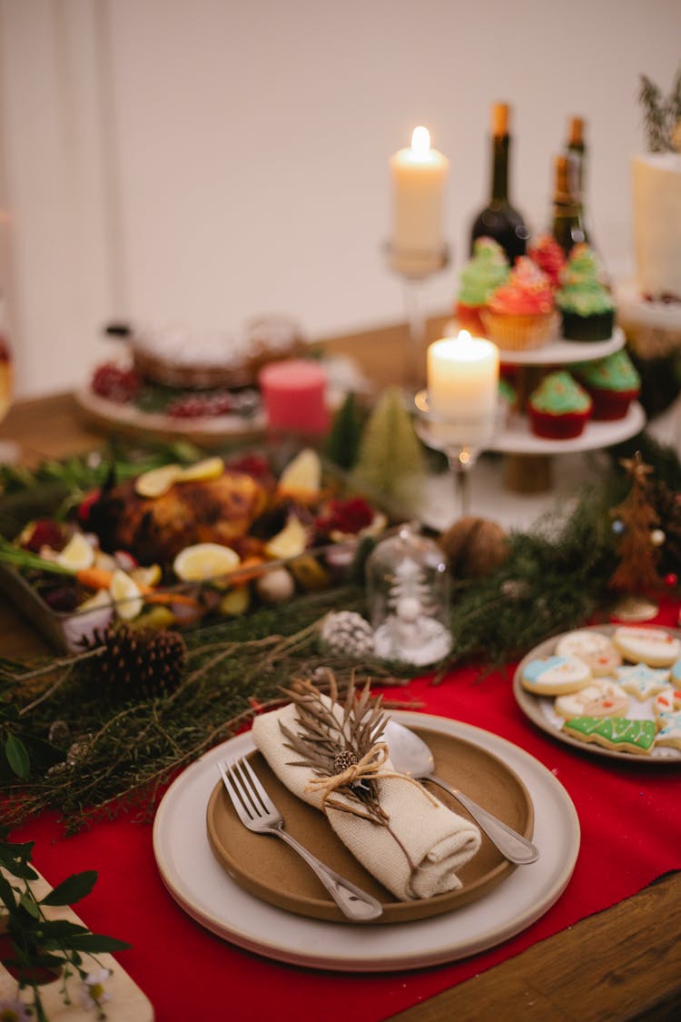 Table Setting With Burning Candles During Christmas Holiday