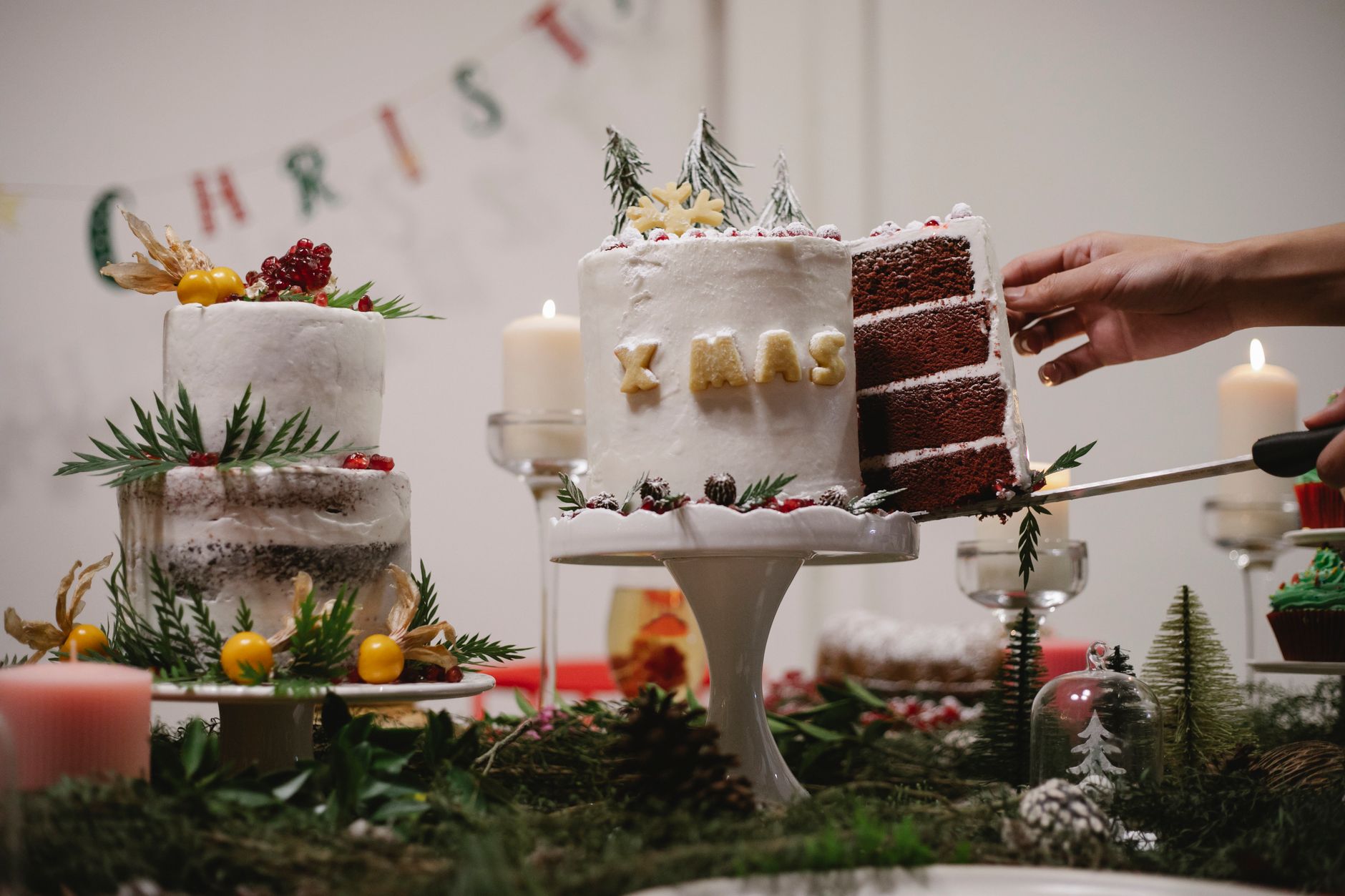 Christmas wreath layer cake decorated with candies and marzipan leaves