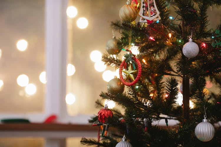 Christmas Tree Decorated With Baubles And Garland