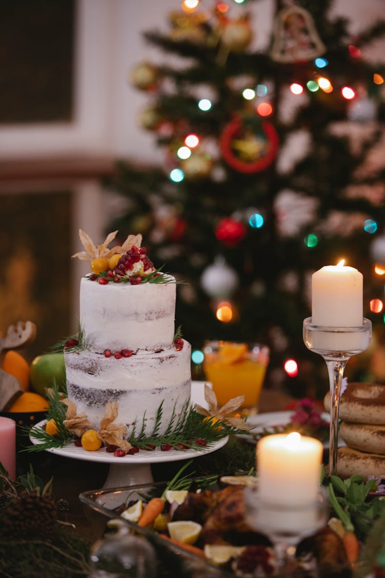 Burning Candles Near Two Tier Cake