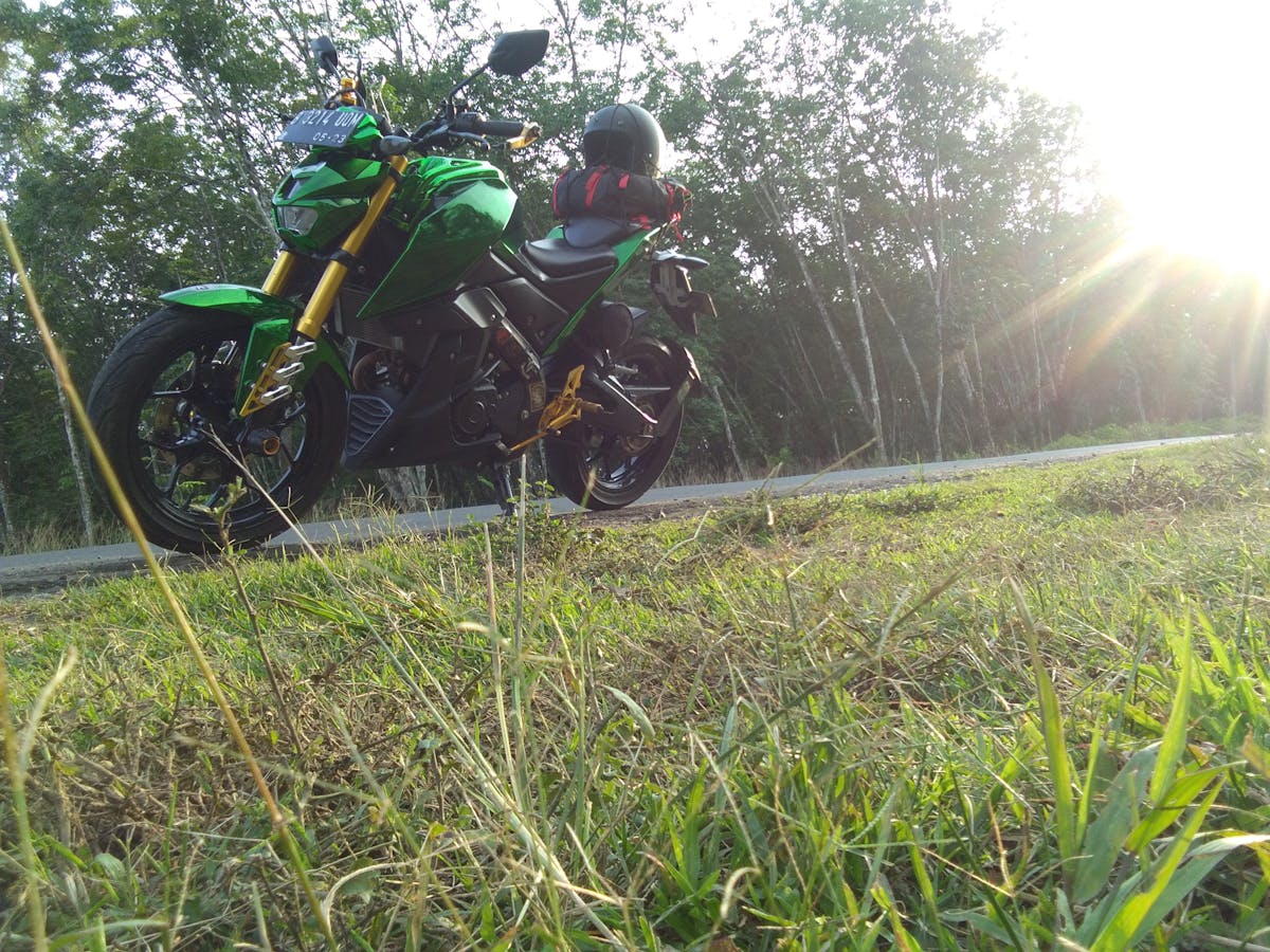 Person in gender-fluid streetwear with oversized blazer and wide-leg trousers in a modern apartment