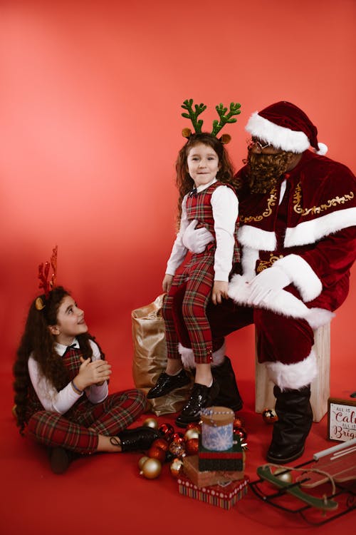 Kids Sitting Beside Santa Claus