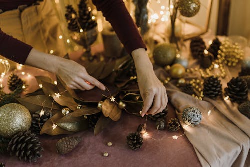 Close-up of Woman Making Christmas Light Decorations