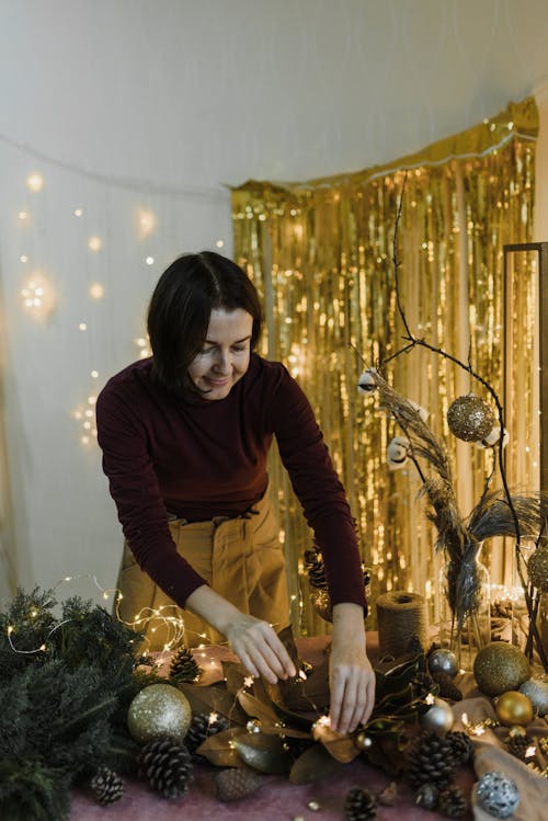Woman Making Decoration at Christmas Time 