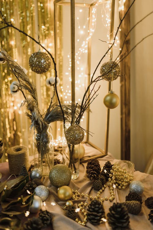 Free Gold and Brown Christmas Decorations on a Brown Table Stock Photo