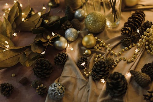 Christmas Decorations on a Pink Surface with Brown Textile