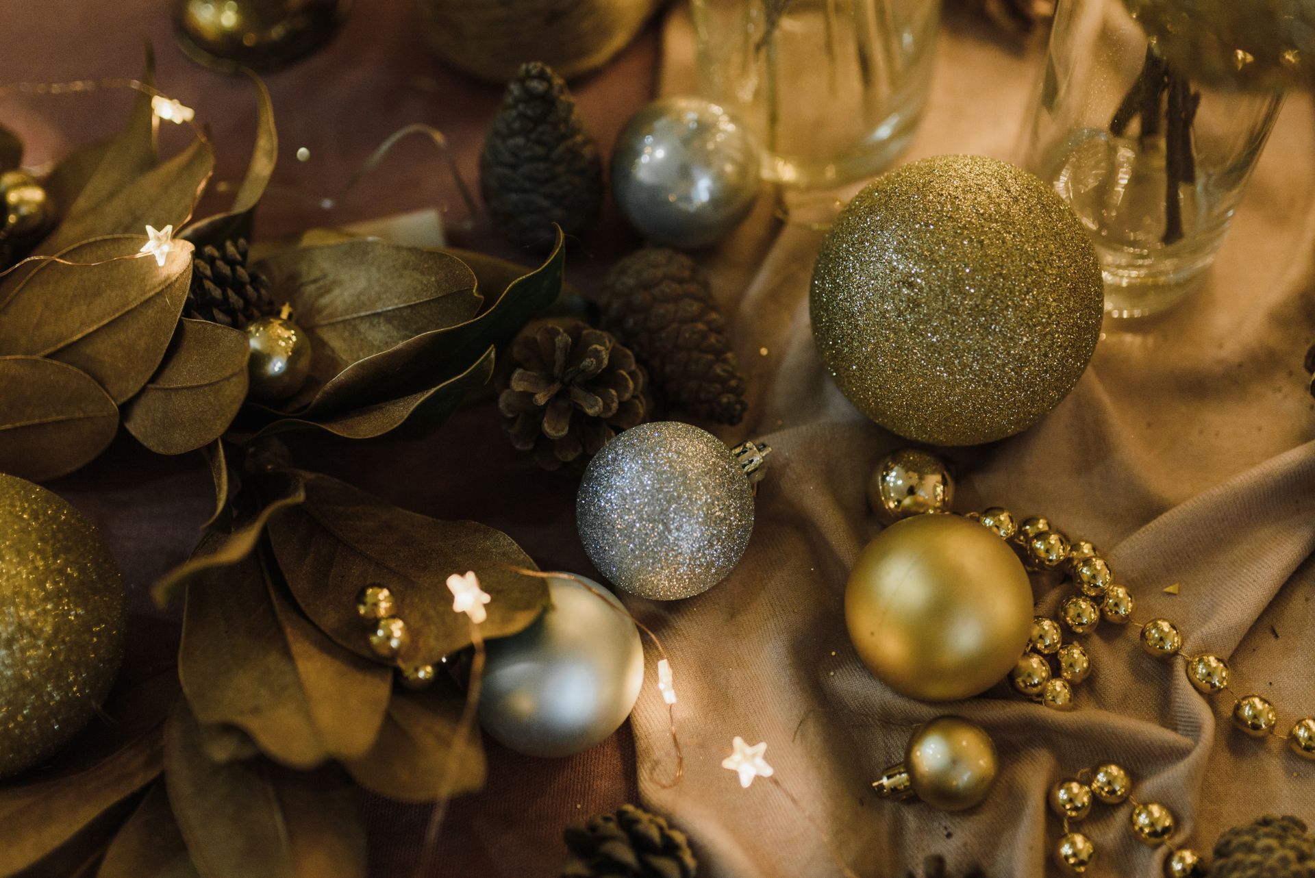 Elegant holiday decor with golden and silver glitter ornaments for festive celebrations.