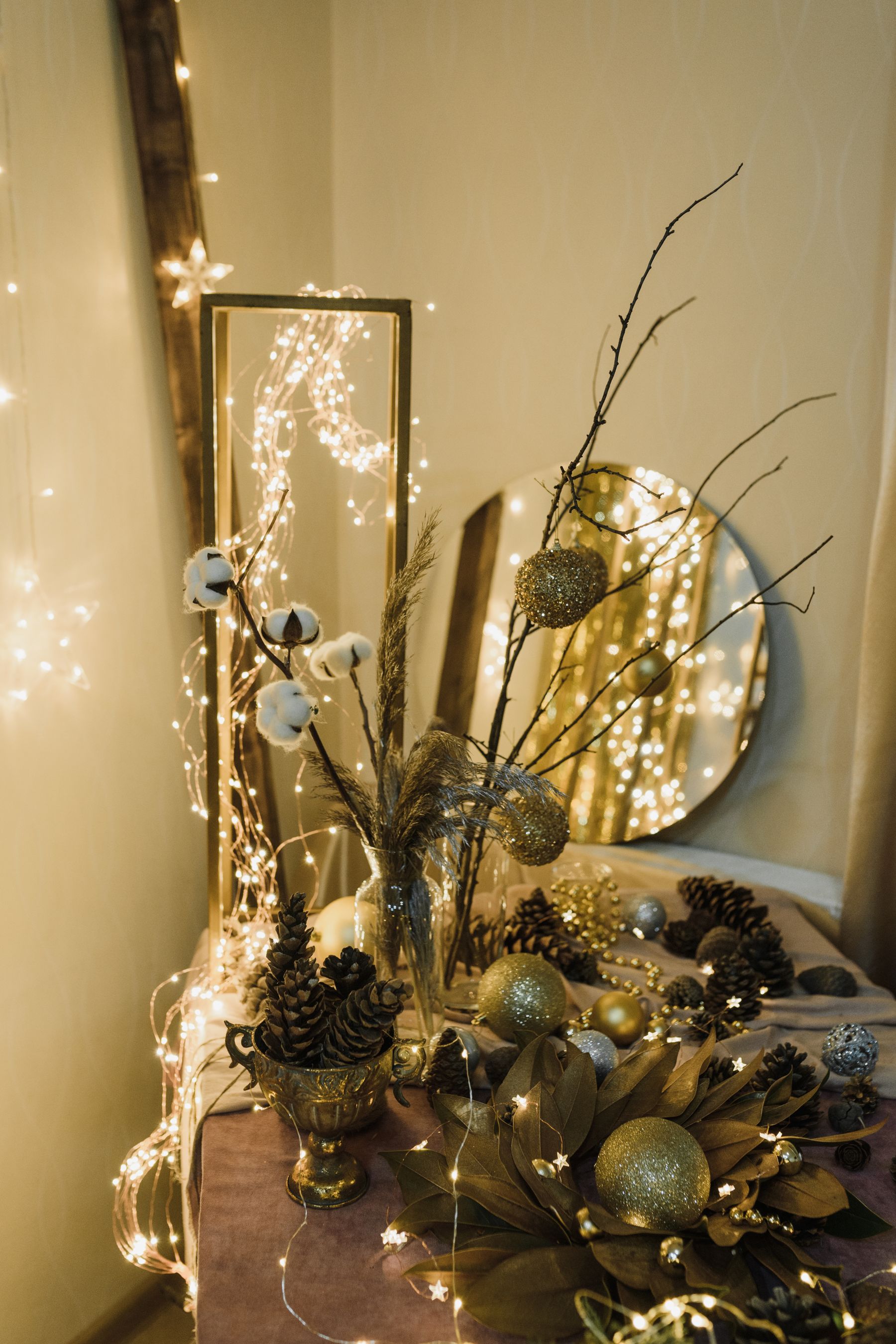 Christmas mantel decor arranged around permanent wall art