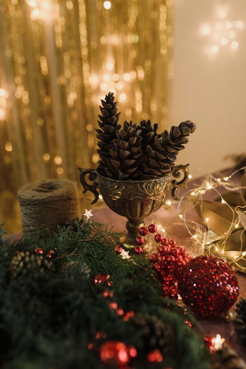 Green Branches, Pine Cones and Baubles to Make a Christmas Decoration 
