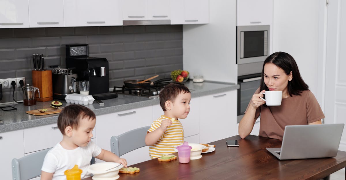 Children Putting Away Electronics During Family Meal
