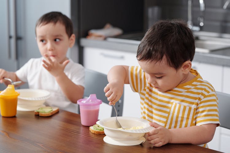 Children Eating Breakfast At Table