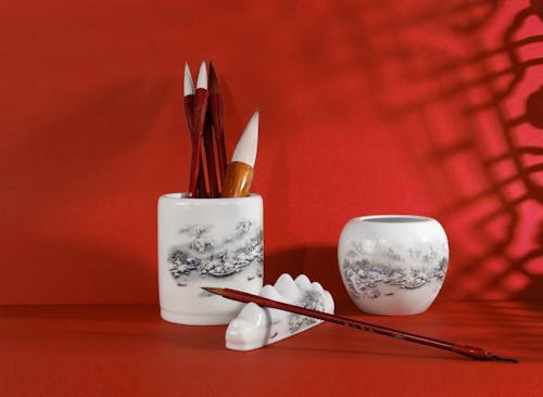 Brushes on White Ceramic Cup