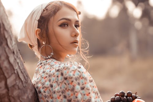 Free Young woman with grape in countryside Stock Photo