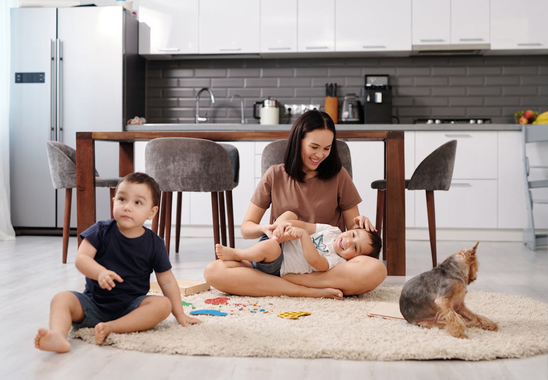 Free A Mother Playing with Her Children  Stock Photo