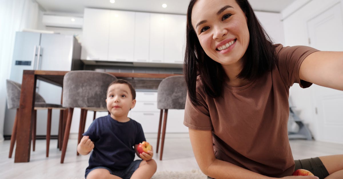 Parent And Child Interacting In A Home Setting, Showing Emotional Expressions And Connection