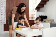 Mother and Her Children Playing at the Kitchen