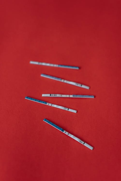 Close-Up Shot of Positive Pregnancy Test Strips