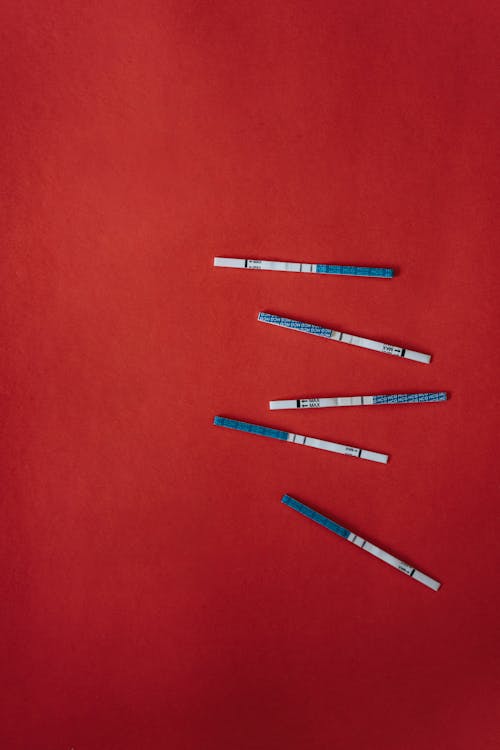Close-Up Shot of Positive Pregnancy Test Strips