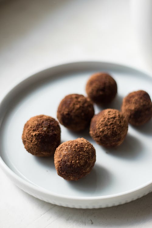 Brown Round Chocolate Truffle on a White Plate