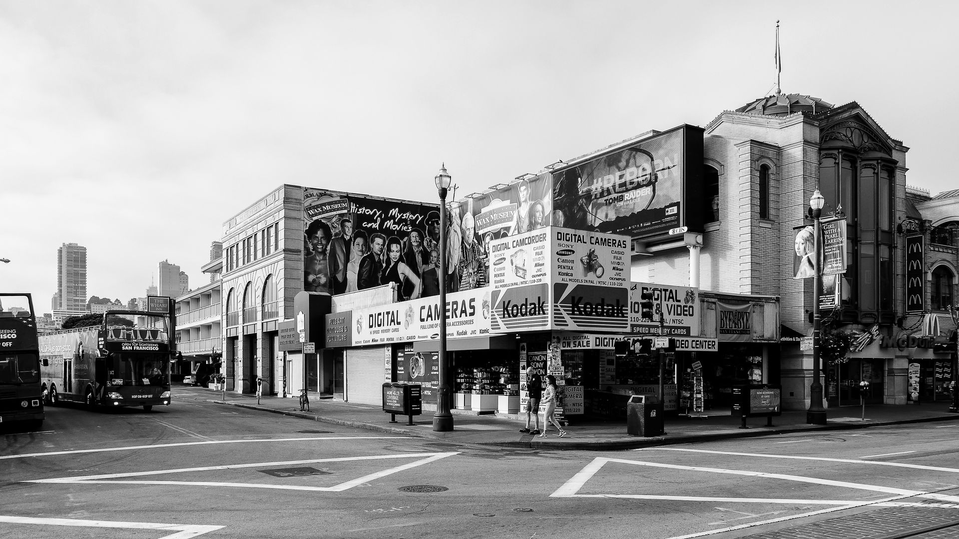 A Grayscale of a Establishments by the Road