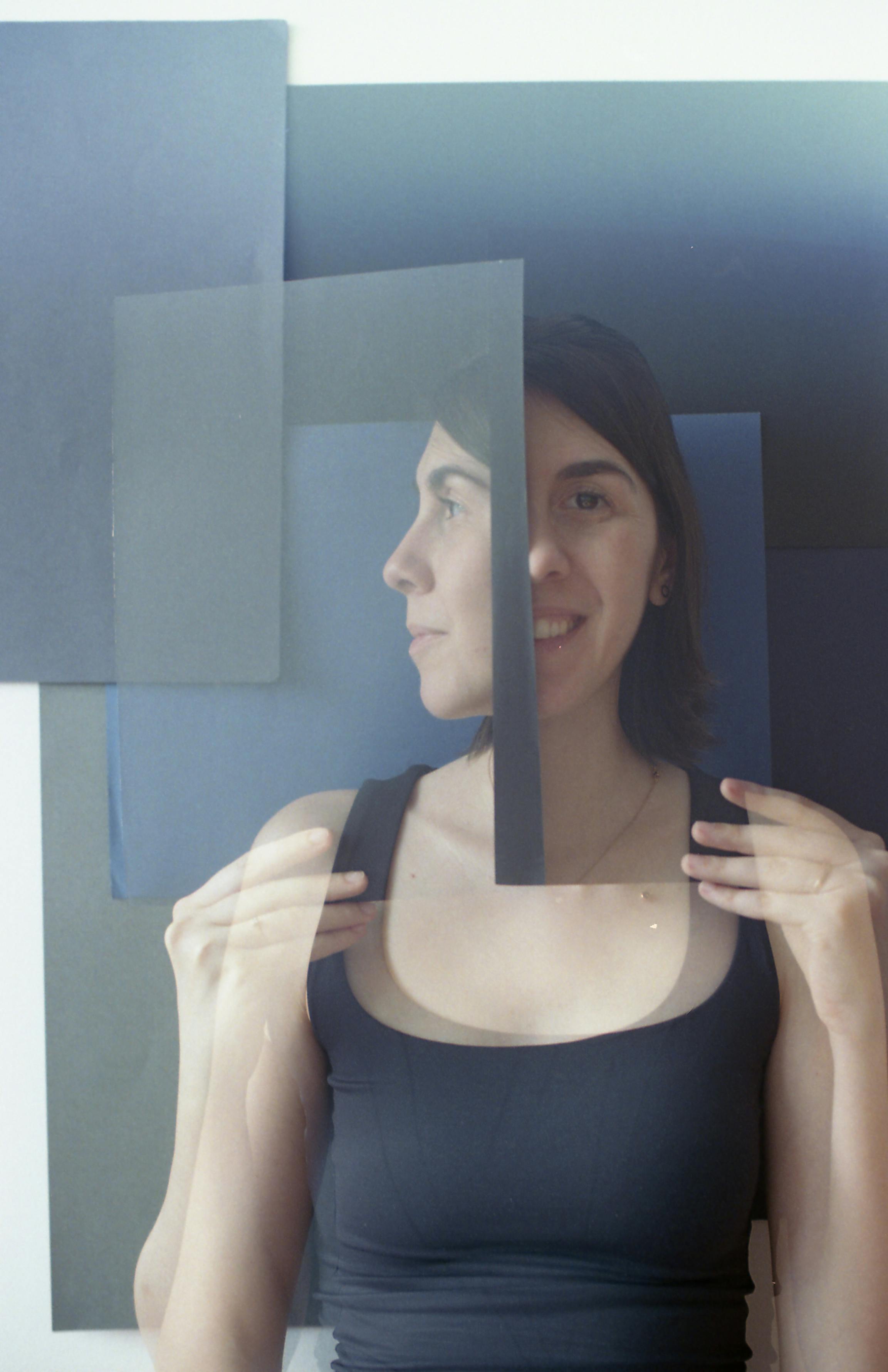 A unique portrait of a woman with abstract reflections and layered visuals.