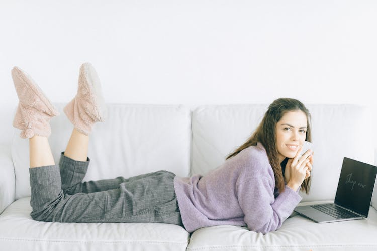 A Woman Lying On Sofa  Online Shopping