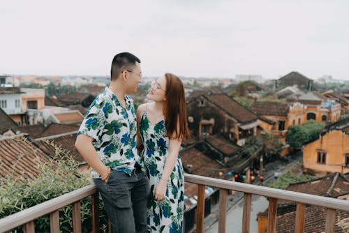 Happy couple standing on rooftop