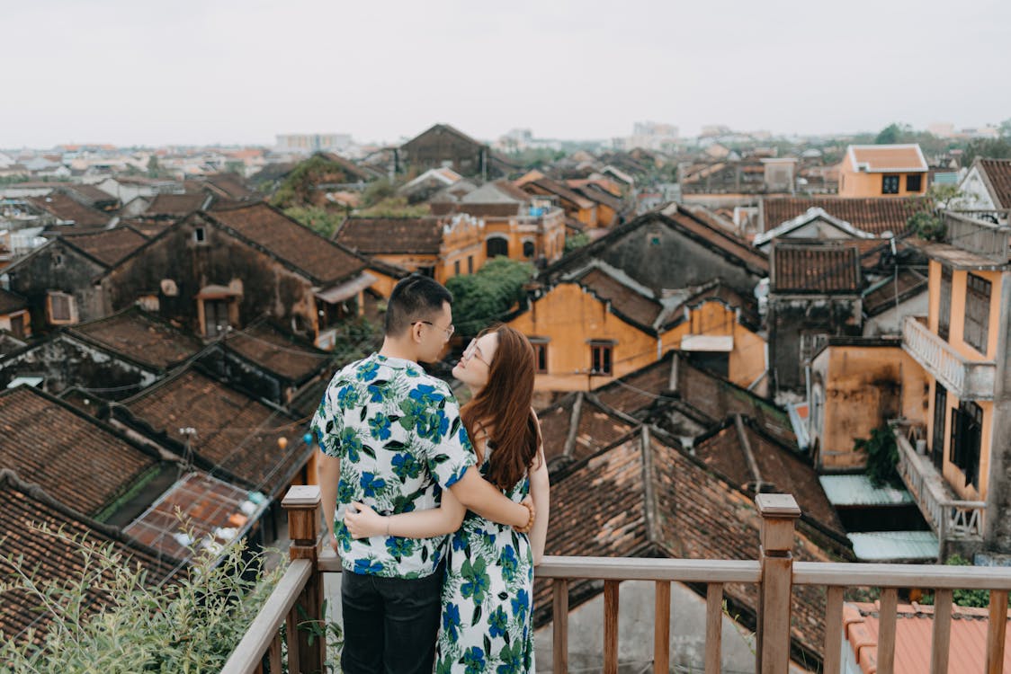 Romantic couple on terrace of rooftop in gloomy day