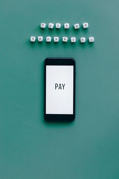 Smartphone displaying 'Pay' with letter blocks spelling 'Online Shopping' on a green background. Perfect for e-commerce themes.
