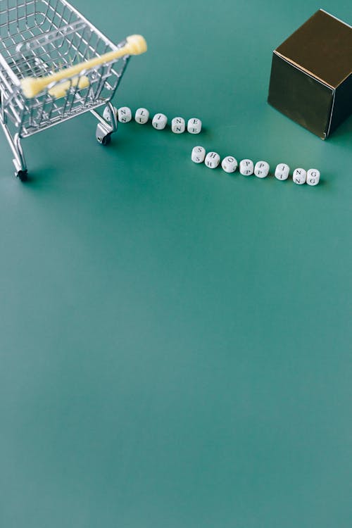 Miniature of Shopping Cart on Green Background