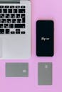 Black Iphone 7 on Pink Surface