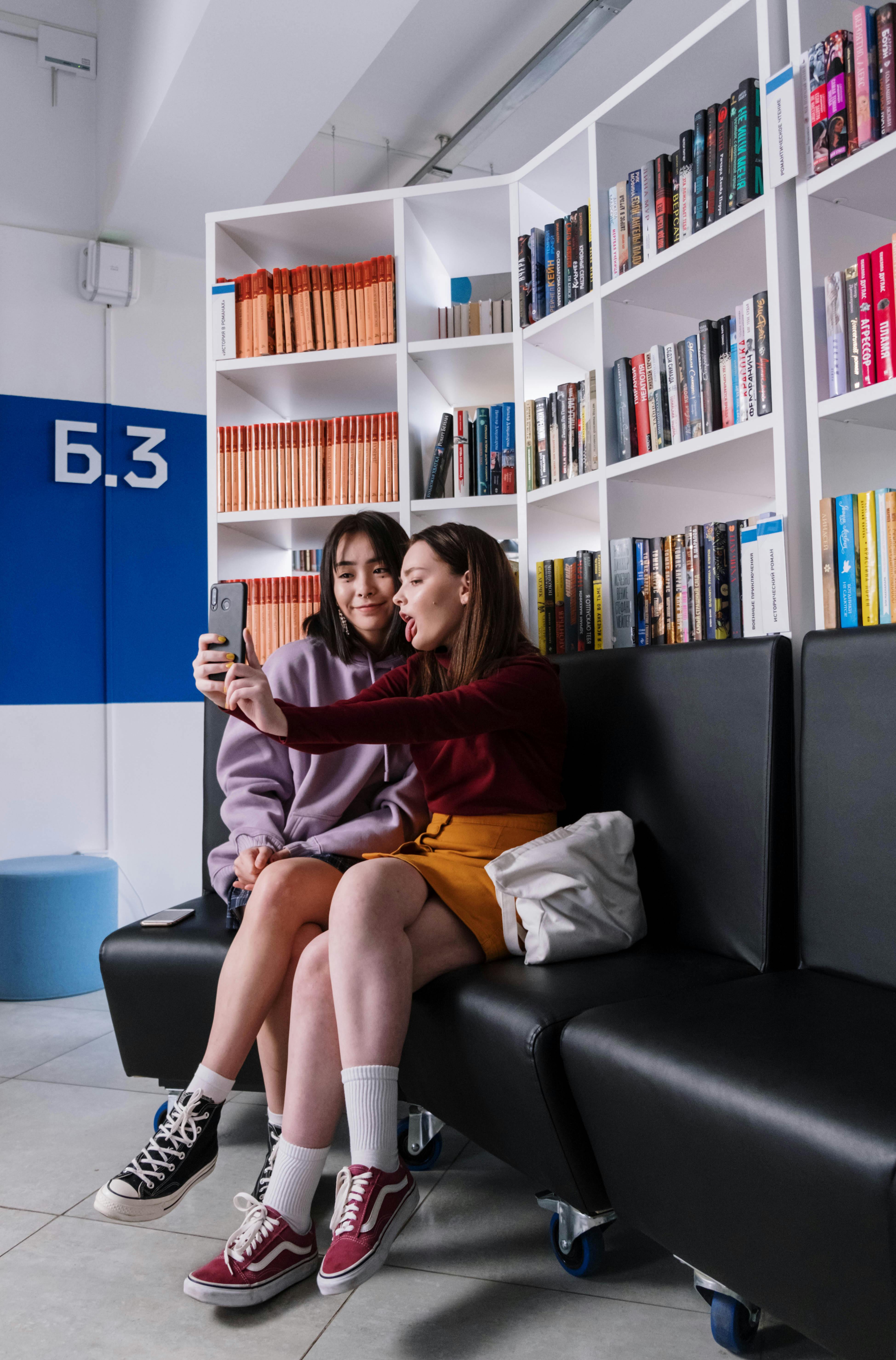 two teenagers taking a selfie