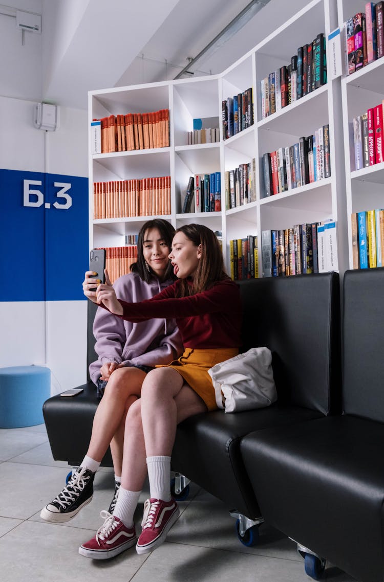 Two Teenagers Taking A Selfie