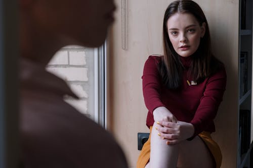 A Female Teenager Wearing Red Long Sleeves