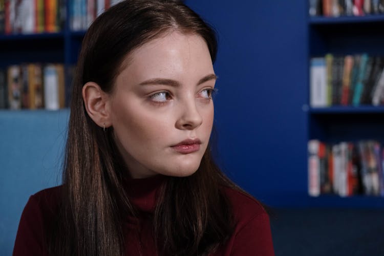 Portrait Of A Serious Female Teenager Looking To Her Left