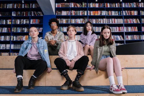 Free Teenagers Sitting Inside the Library Stock Photo
