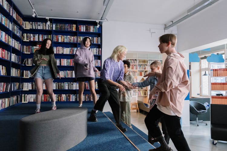 Women And Man In Library